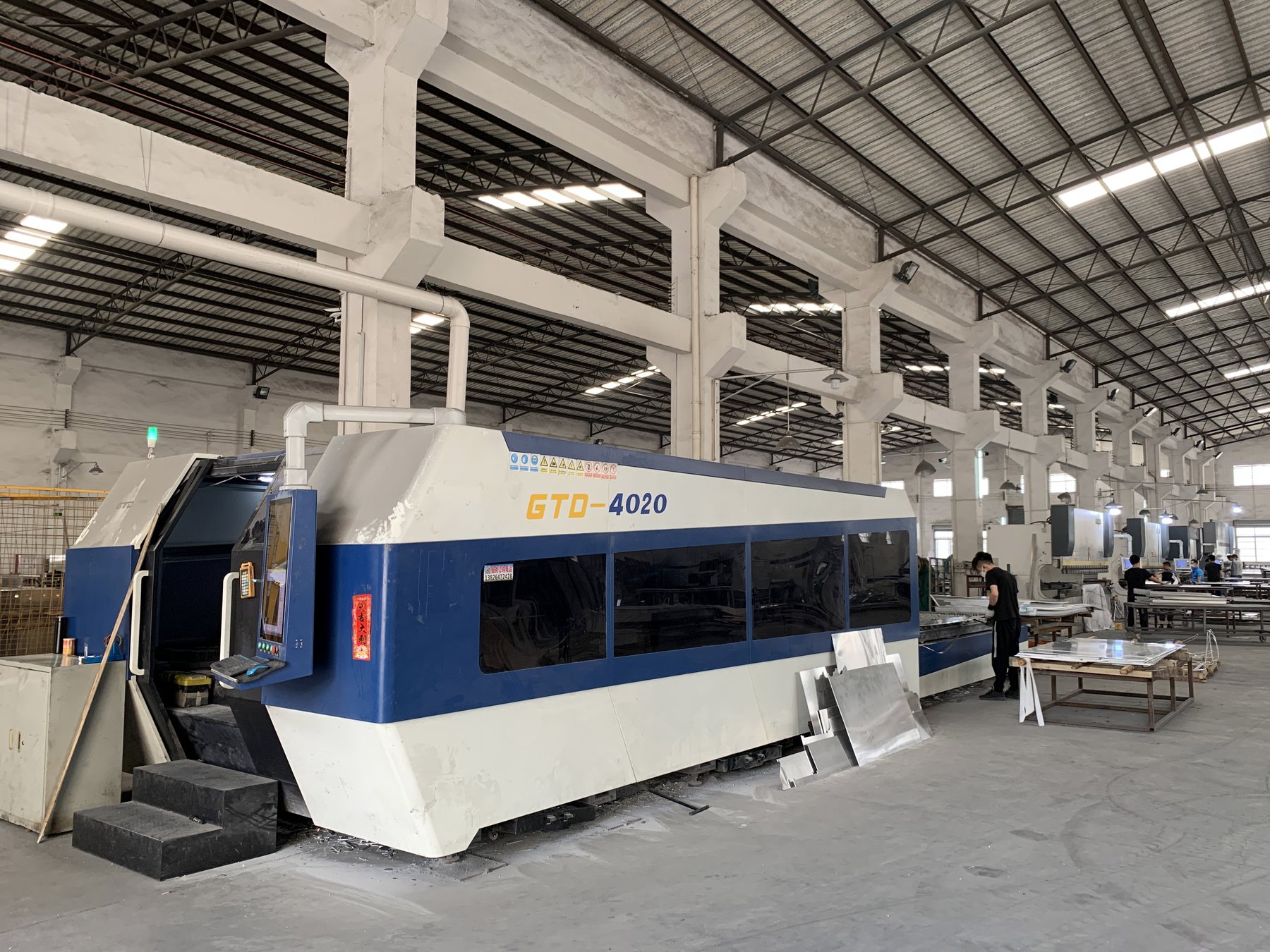 real CNC cutting and punching machine for solid aluminum panel production