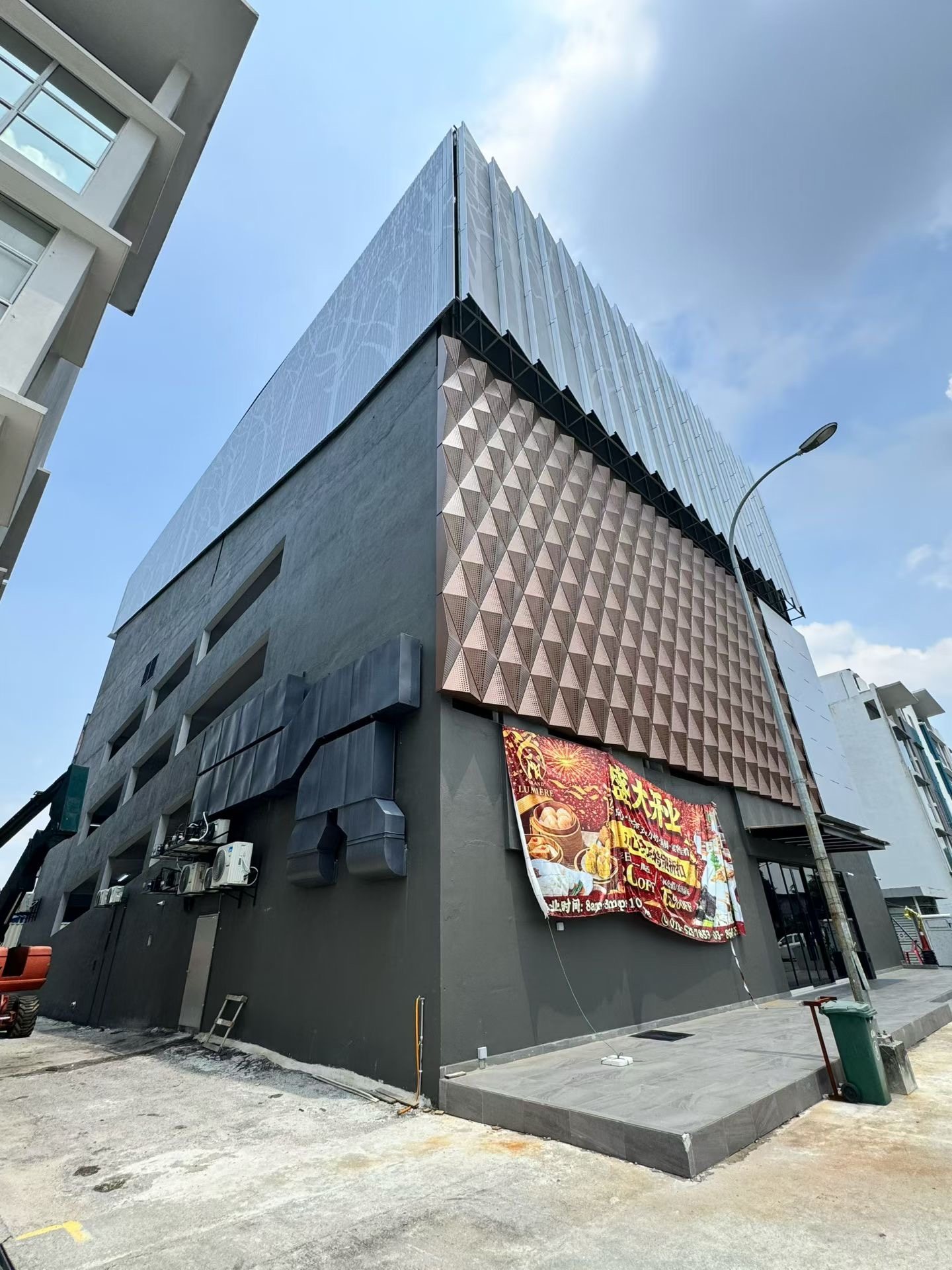 Street view of Malaysia hotel aluminum facade cladding project by Punchuk