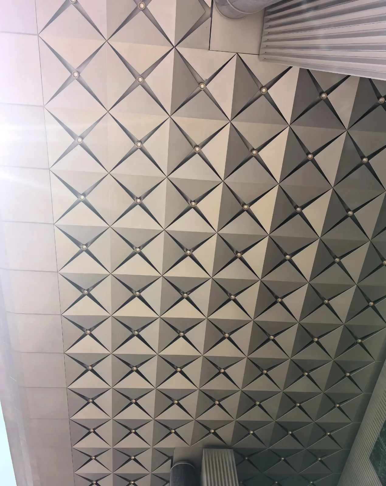 Modular pyramid aluminum ceiling panels with integrated round lights