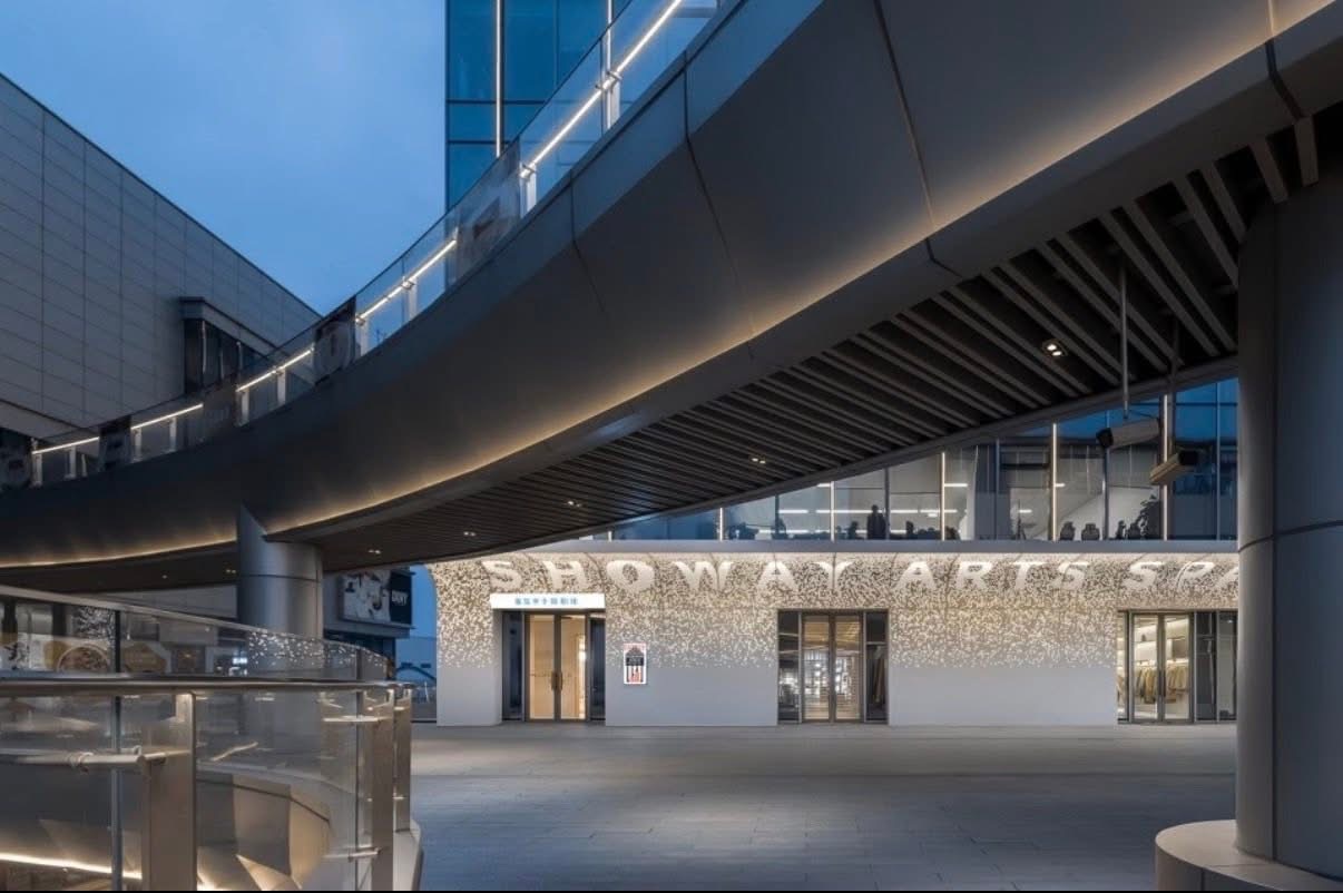 Shopping mall arts space facade using backlit perforated aluminum panels